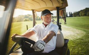 old man in golf cart