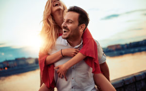 man laughing with woman